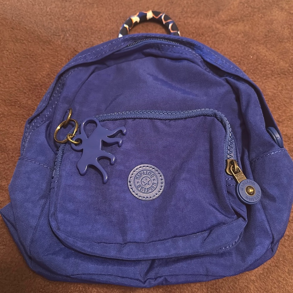 Kipling mini backpack. NWT. Can wear as crossbody or backpack.